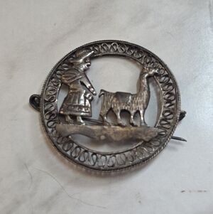 Silver Brooch with Shepherd and Llama Design